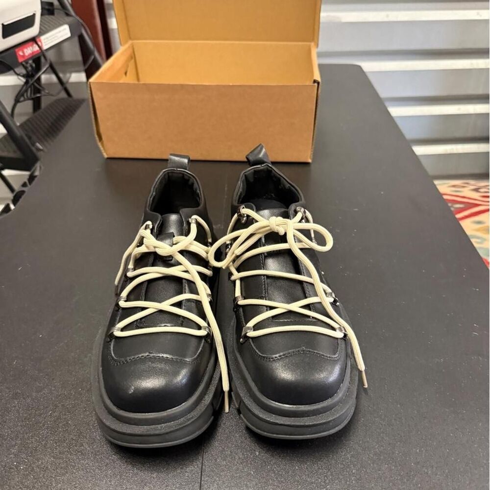 Black leather lace-up shoes with chunky sole, size US 9